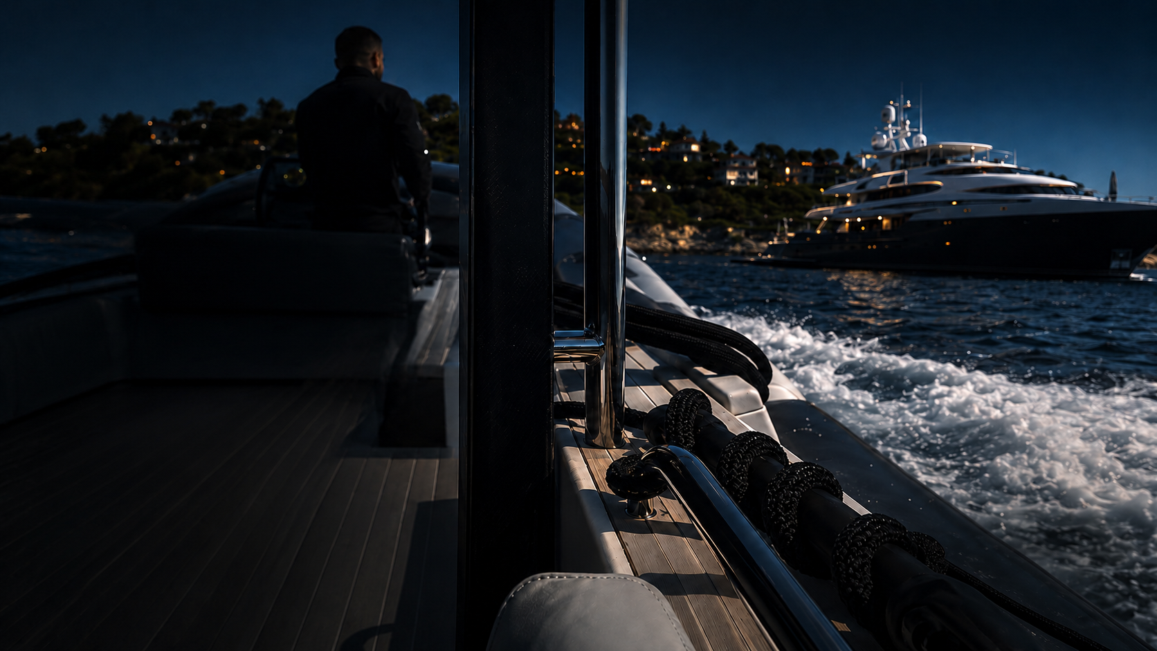 Security team member aboard a tender moving alongside a superyacht at night